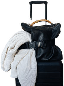 A black bag with a white scarf and a bamboo belt.